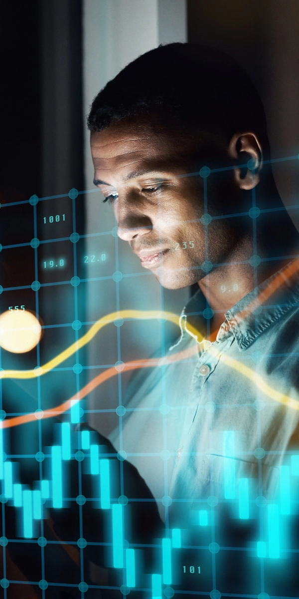 A person looking at a screen with digital financial graphs and data overlays, suggesting analysis or monitoring of stock market trends with advanced Business Intelligence for CFOs.